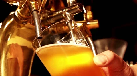 Pouring the beer in slow motion Stock Footage 67858510