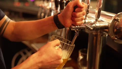 Pouring Beer from Tap in Bar Stock Footage 328952688
