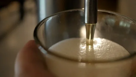 Pouring a beer from tap Stock Footage 128097036