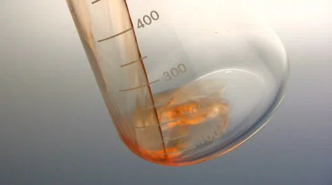 Pouring biofuel into flask Stock-Footage 781219