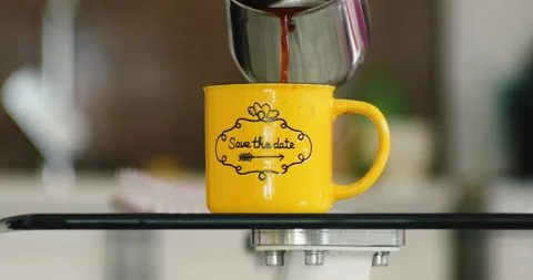 Pouring Black Coffee To A Yellow Cup Stock Footage 232780366