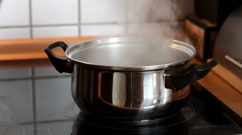 Pouring boiling water in a pot Stock Footage 49655280
