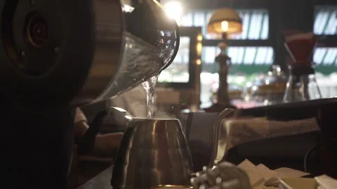 Pouring Boiling Water into a Teapot Stock Footage 293371894