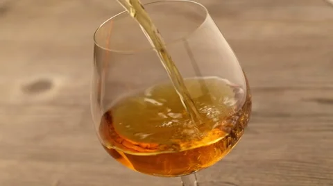Pouring brandy into the glass Stock Footage 47405008
