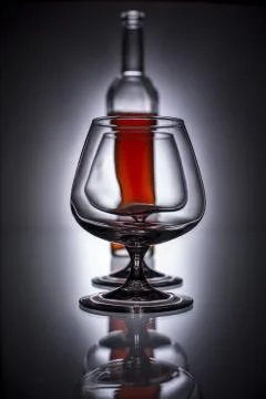 Pouring brandy into a glass Foto stock
