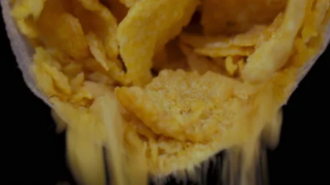 Pouring breakfast corn flakes cereals from plastic bag 4k Stock Footage 148313865