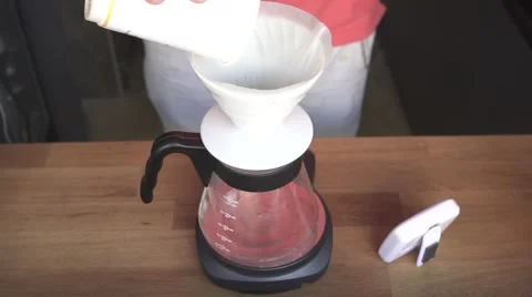 Pouring brewed coffee into coffee pot with timer, slow motion Vídeos de archivo 67905037