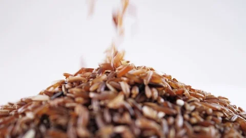 Pouring brown rice Stock Footage 103239510