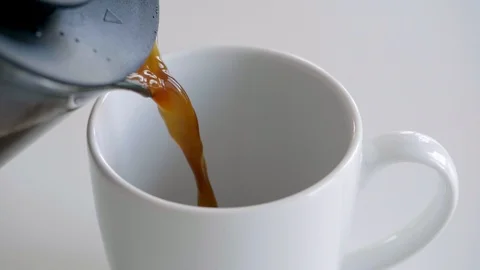 Pouring caffee into cup slow motion in 120 fps hd Stock Footage 93159261