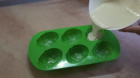 Pouring cake batter into baking pan Stock Footage 51740919