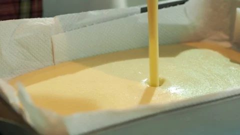 Pouring cake batter into the baking pan Stock Footage 128002871
