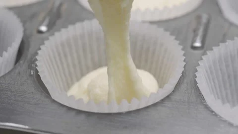 Pouring Cake Batter Into Cupcake Liner Macro Close Up Видео 332811177
