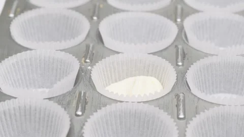 Pouring Cake Batter Into Cupcake Molds Close Up Stock Footage 332811340