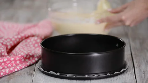 Pouring Cake Mixture Into Baking Tin. Stock Footage 121060223