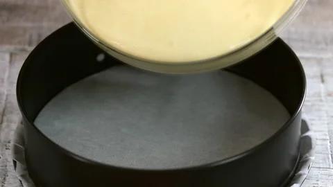 Pouring Cake Mixture Into Baking Tin. Close-up Stock Footage 121089542