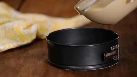 Pouring Cake Mixture Into Baking Tin. Stock Footage 121788319