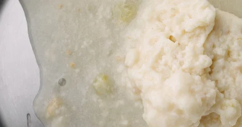 Pouring canned clam chowder into a pan Stock Footage 101984325