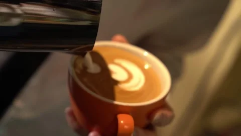Pouring Capuccino  in cup Stock Footage 314908727