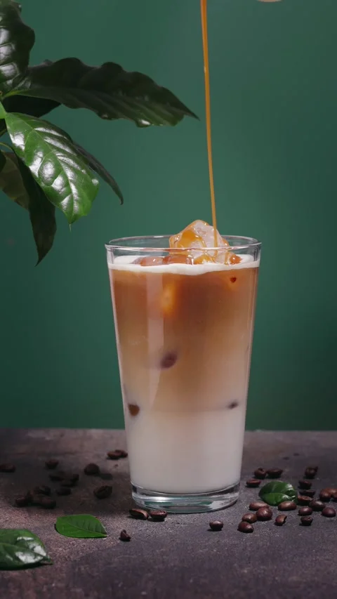 Pouring caramel into iced coffee Stock Footage 239003643