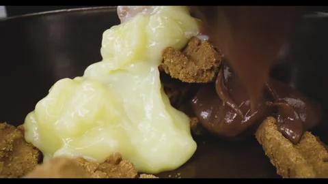 Pouring castard on biscuits, macro shot, desert Stock Footage 146514583