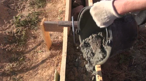 Pouring cement from the bucket Stock Footage 64985017