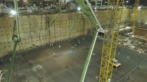 Pouring cement at construction site at night. Video stock 123552005
