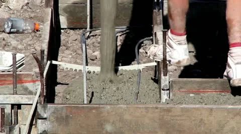 Pouring Cement into Foundation Stock Footage 11245458