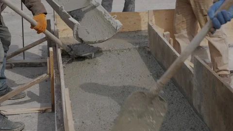 Pouring cement mortar into formwork Stock Footage 124030759