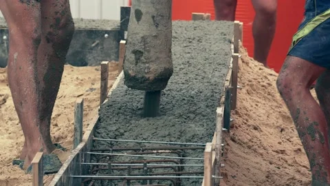 Pouring cement or concrete with automatic pump, construction site with Stock Footage 165572171