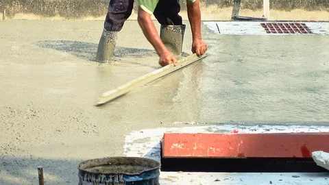 Pouring cement for road construction. Stock Footage 117465976