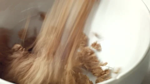 Pouring Cereal Into a Bowl Stock Footage 130679112
