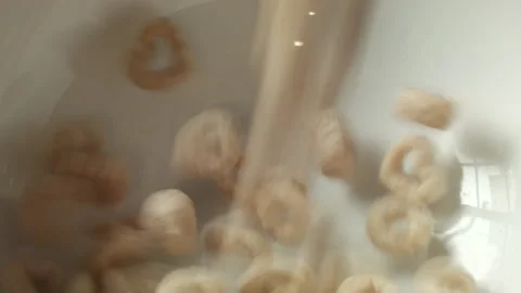 Pouring Cereal Into a Bowl Stock Footage 130679397