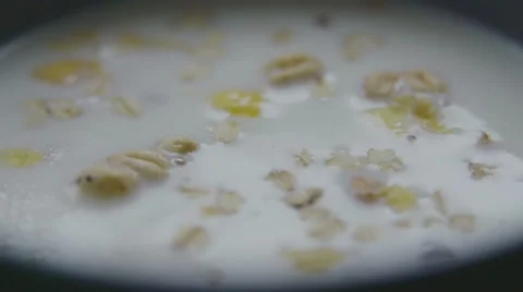 Pouring cereal into milk speed up Stock Footage 57638861