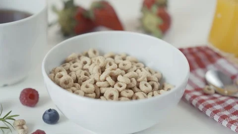 Pouring cereal rings into a bowl in slow motion. Food and nutrition concept Stockbeeldmateriaal 106141663