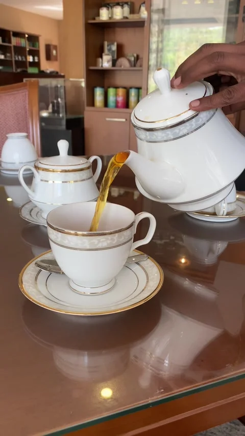 Pouring Ceylon tea into elegant teacups in Sri Lanka Stock Footage 314369719