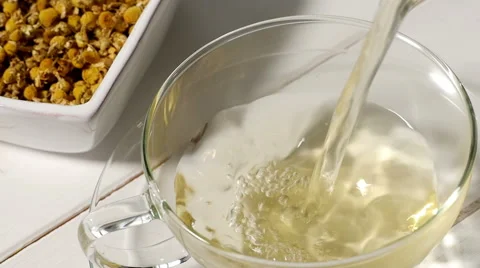 Pouring chamomile tea, slow motion Stock Footage 49250035