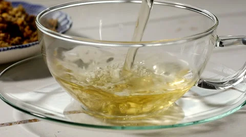 Pouring chamomile tea, slow motion Stock Footage 49251484