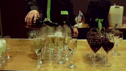 Pouring champagne in flutes Stock Footage 77053845