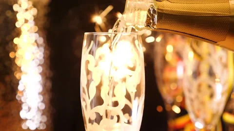 Pouring champagne in front of firework Stock-Footage 169397890