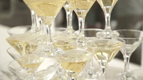 Pouring champagne into a glasses Stock Footage 76693313