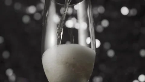 Pouring Champagne Wine on shine background. Stock Footage 323317893