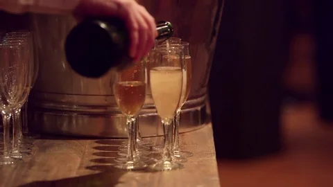 Pouring champange in flutes Stock Footage