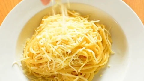 Pouring cheese on spaghetti. Stock Footage 73140714