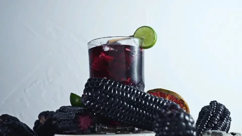 Pouring Chicha Morada, Purple Corn Drink with Lime and Cinnamon Stock Footage 335893711