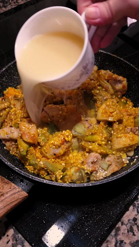 Pouring Chicken Broth Over Rice for Paella Cooking. Stock Footage 344967629