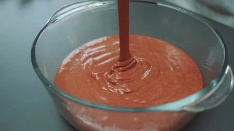 Pouring chocolate batter into a baking dish Stock Footage 252240392
