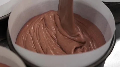 Pouring Chocolate Cake Batter into a Baking Pan Stock Footage 331785668