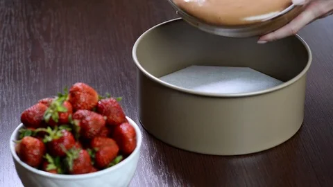Pouring chocolate cake mixture into tin. Making pastry dough. Stock Footage