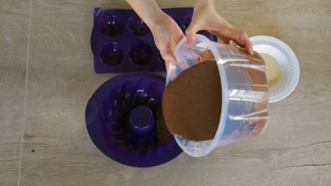 Pouring chocolate into can. Using cooking bag, confectioner making cake Stock Footage 144918870