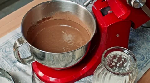 Pouring chocolate dough into baking pan Stock Footage 68018013